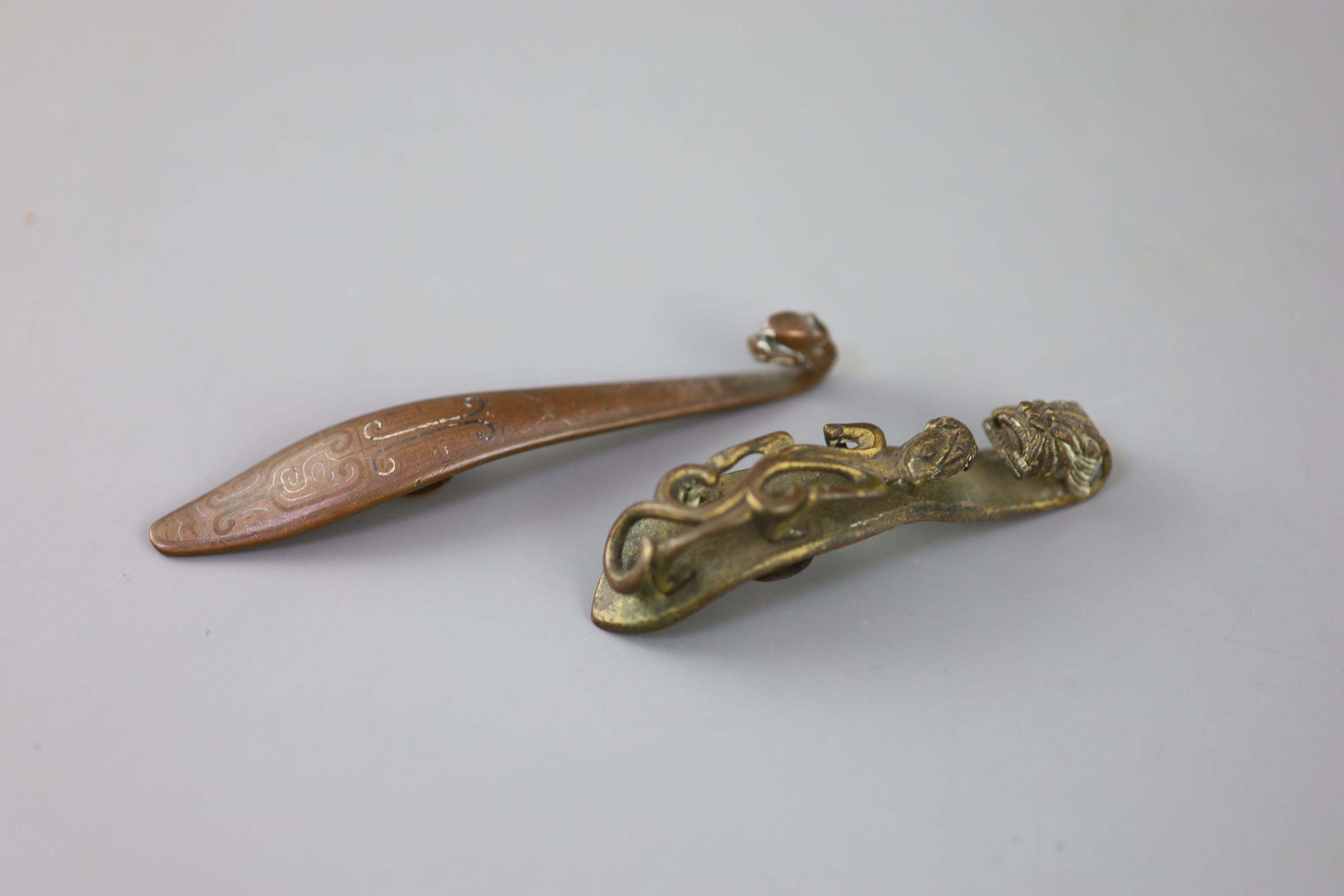 A Chinese archaistic silver and copper inlaid bronze belt hook and a bronze chilong belt hook, 18th/19th century,